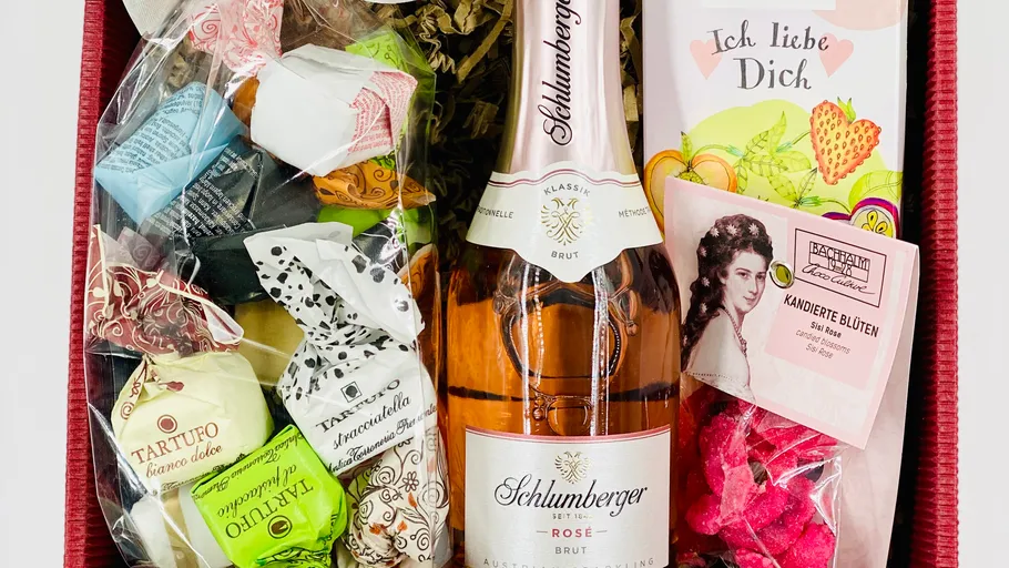 Gift basket with sparkling wine and sweets.