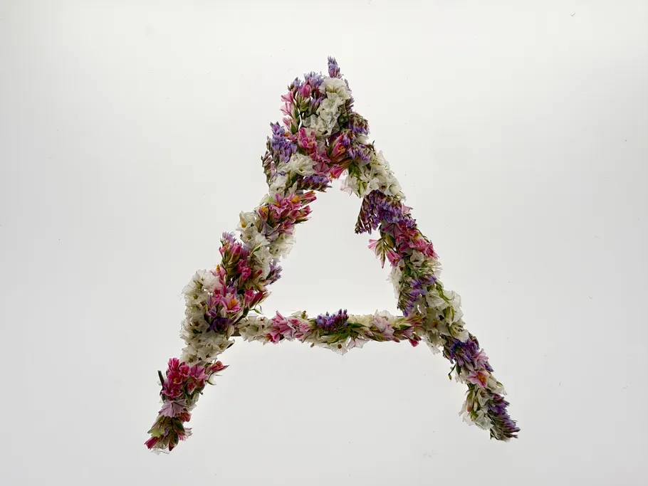 Floral letter A on white background.
