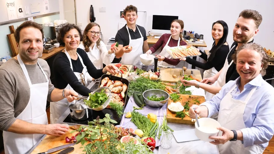 Group cooking together in a kitchen.