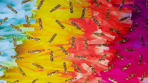 Colorful fabric with sequins arranged randomly.