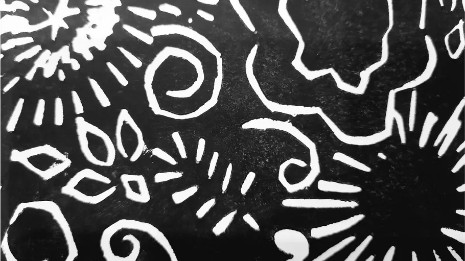 Abstract black-and-white pattern with swirls.