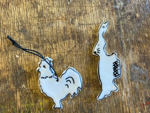 Chicken and rabbit shaped decorations on a table.