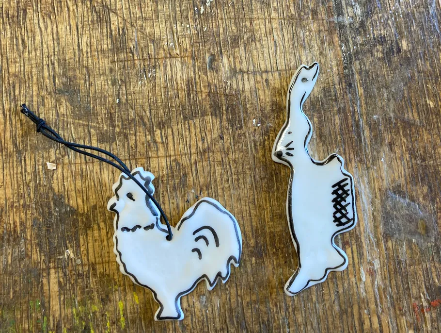 Chicken and rabbit shaped decorations on a table.