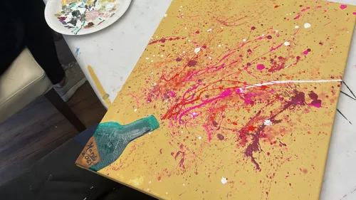 Colorful abstract painting on canvas, splatter style.
