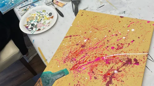 Colorful abstract painting on canvas, splatter style.