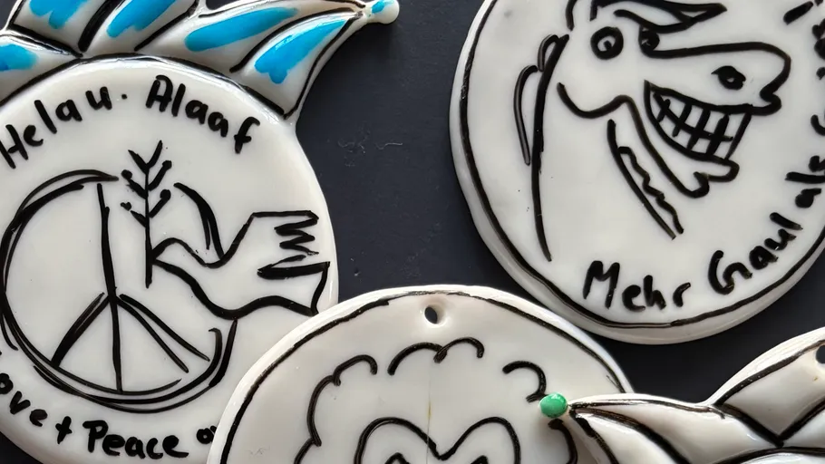 Ceramic decorations with peace and horse designs.