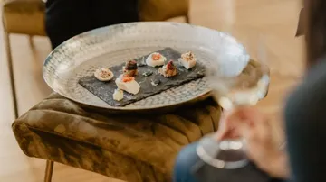 Platter of gourmet appetizers on a table.