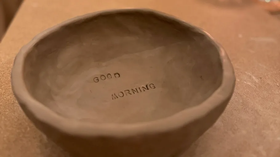 Handmade bowl with 'Good Morning' text inside.