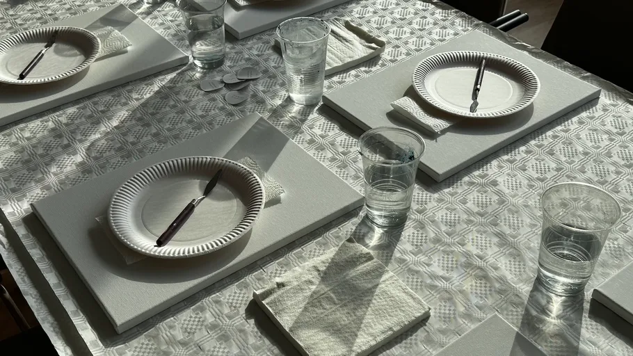 Table set for painting activity preparation.