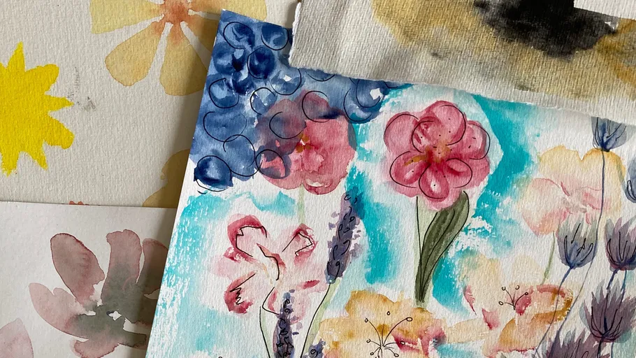 Watercolor floral paintings stacked together.