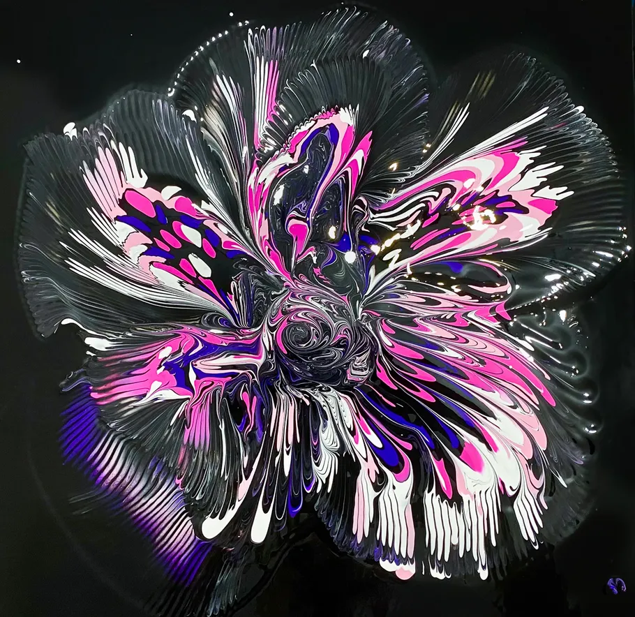 Abstract flower-like swirl with vibrant colors.