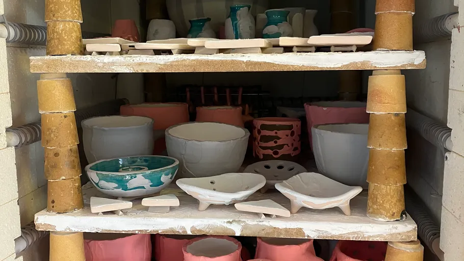 Ceramic pieces in a kiln undergoing firing.