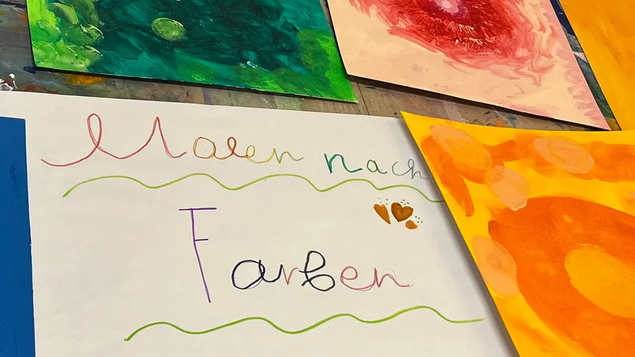 Colorful paintings on a table.