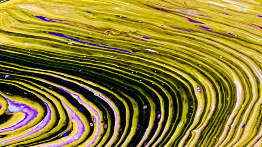 Abstract yellow and black swirling pattern.