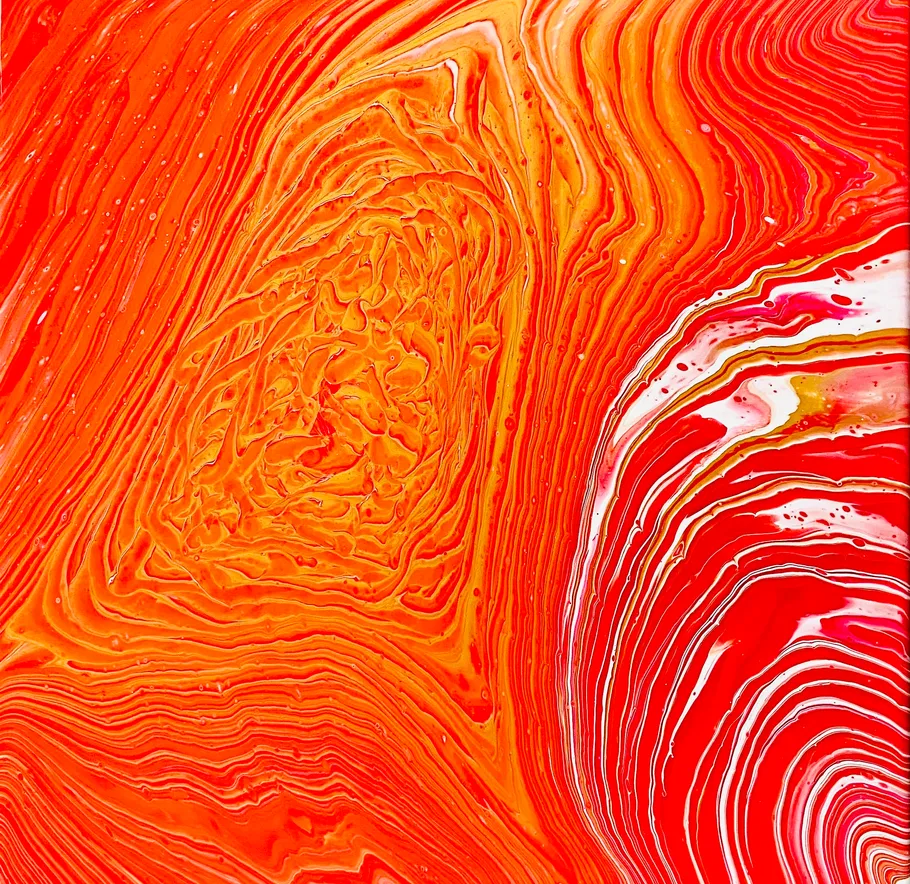 Colorful abstract swirl with orange and red hues.