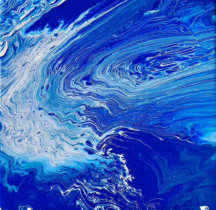 Blue and white abstract swirling paint.