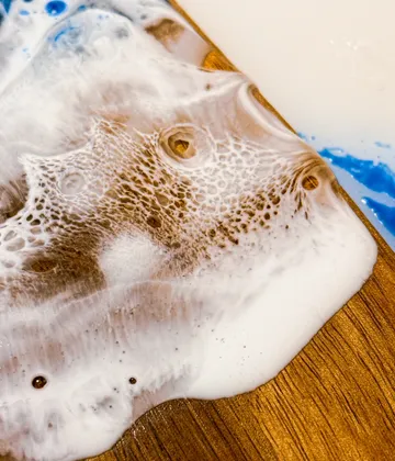 Epoxy resin art on wooden surface.