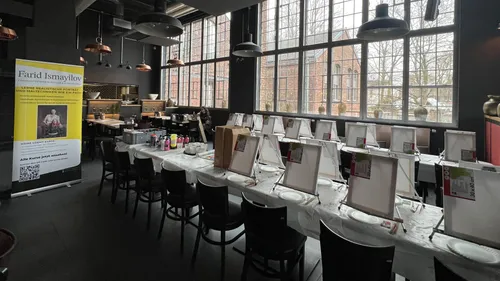 Art workshop setup with easels and paints.