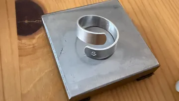 Metal ring on a wooden table.