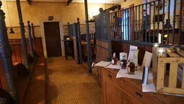 Traditional pub interior with wooden tables.