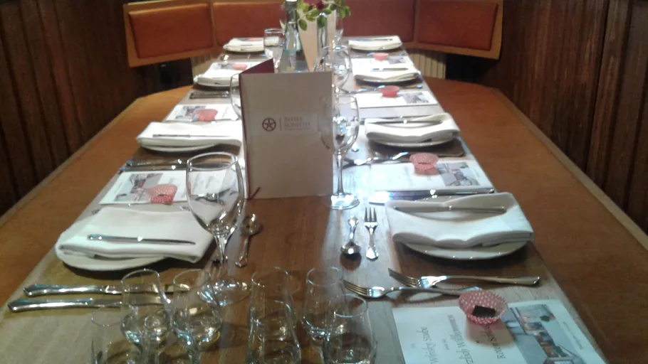 Elegantly set dining table with menus.