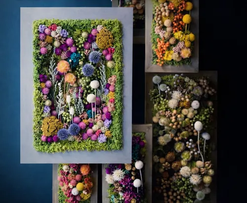 Colorful floral wall art with green border.