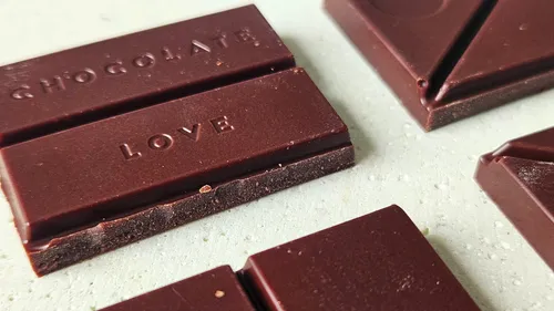 Chocolate pieces on a light surface.