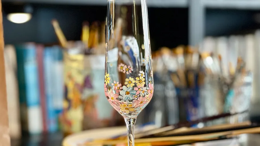 Floral-painted glass in an artist's studio.