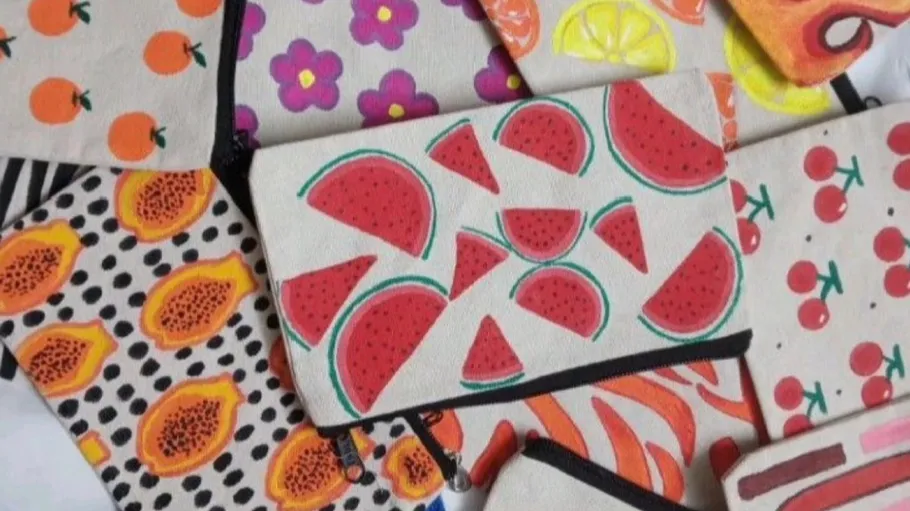 Colorful pouches with fruit designs, scattered.