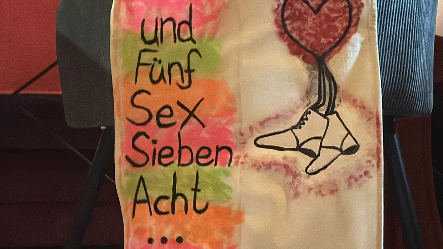 Colorful sign with numbers and shoes drawing.