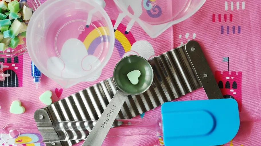 Craft supplies on a colorful tablecloth.