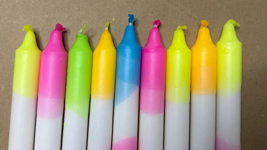 Colorful candles arranged on a surface.