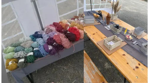 Colorful yarns displayed on a market table.
