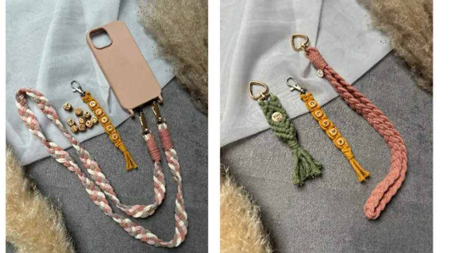 Phone case with braided straps on fabric.