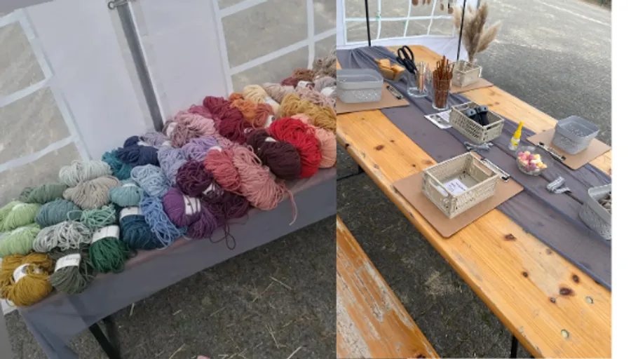 Bunte Garne und Basteltisch im Zelt.