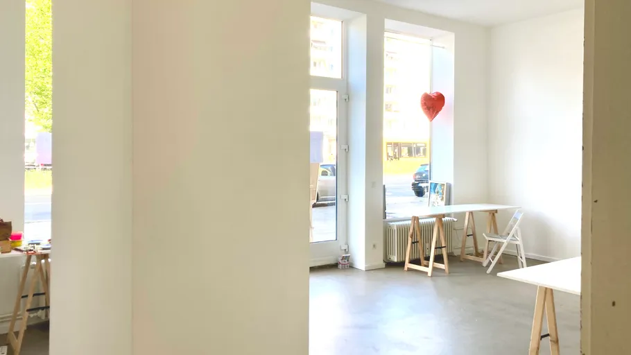 Bright room with tables and heart decoration.