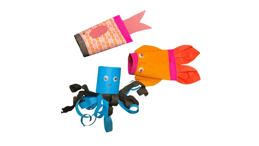 Colorful paper sea creatures on white background.