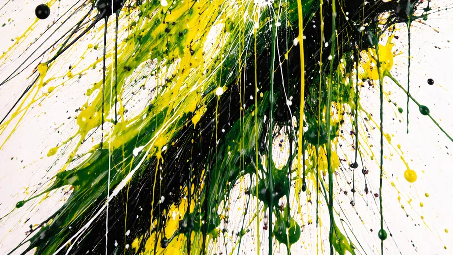 Abstract paint splatters in green and yellow.