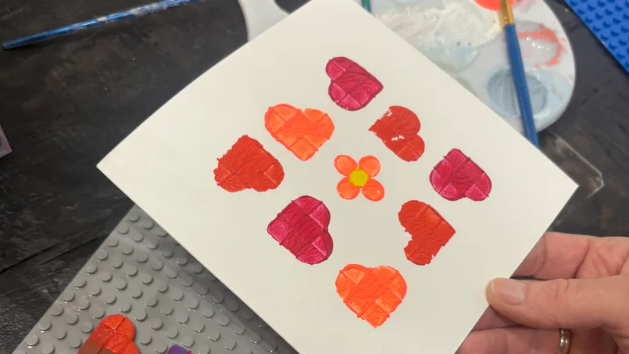 Card with painted hearts and flower design.