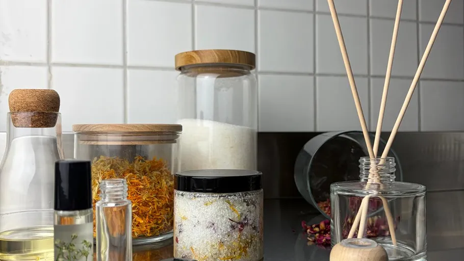 Jars and bottles with spa materials on counter.
