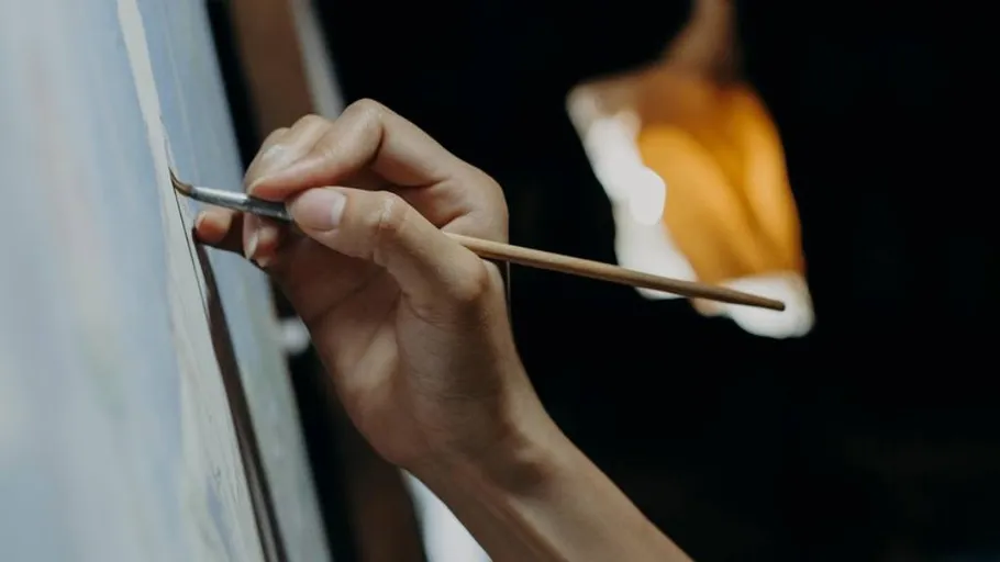 Hand painting on canvas indoors.