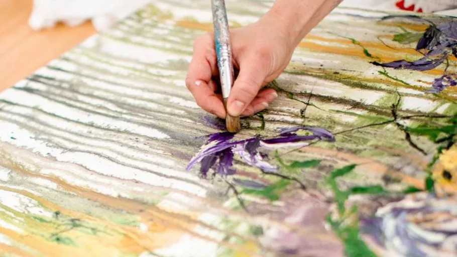 Hand painting on a canvas with brush
