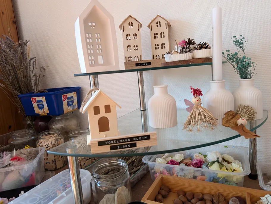 Decorative items on shelves in a craft store.