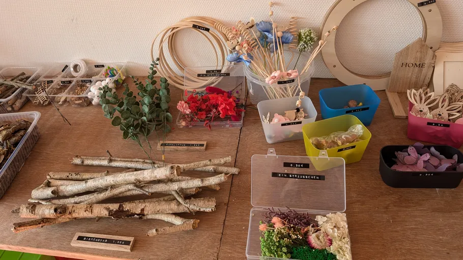 Craft materials displayed on a wooden table.