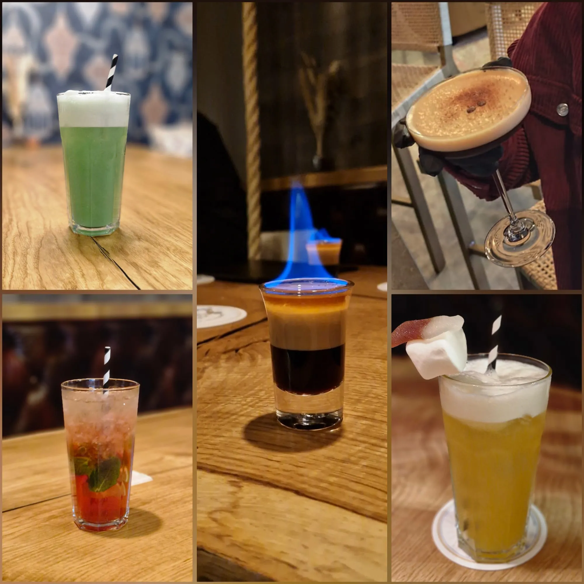 Fünf verschiedene Cocktails auf Holztischen.