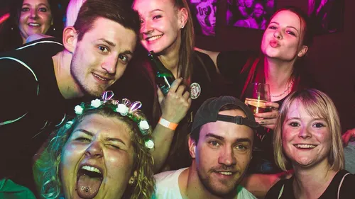 Group celebrating at a lively party.