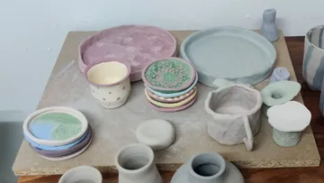 Mixed ceramic pottery on a table.