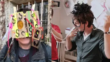 Two people wearing creative headgear indoors.