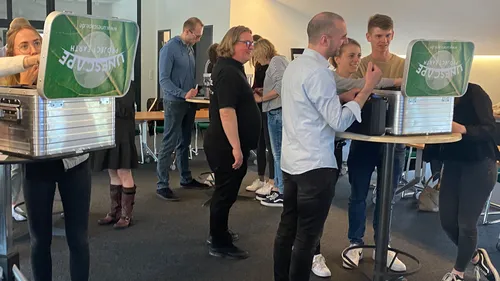 People solving puzzles in office setting.