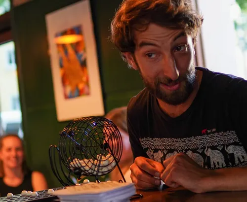 Man playing bingo in a bar setting.